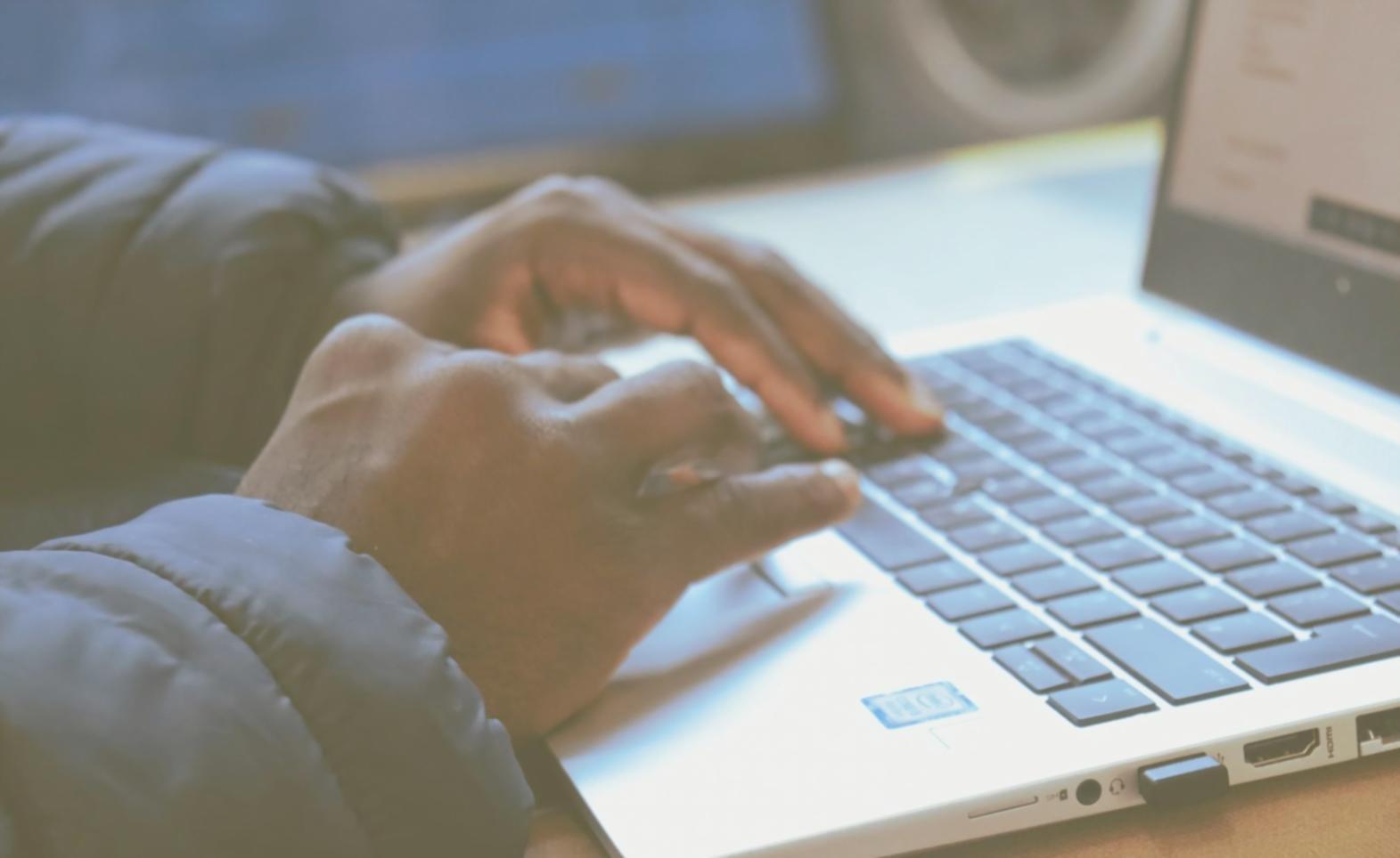 Professional analyzing financial charts and data on computer screens